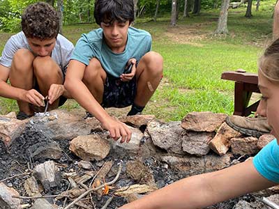 Teens making a fire