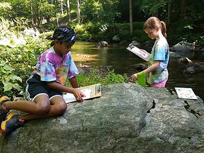 Kids creating art at stream