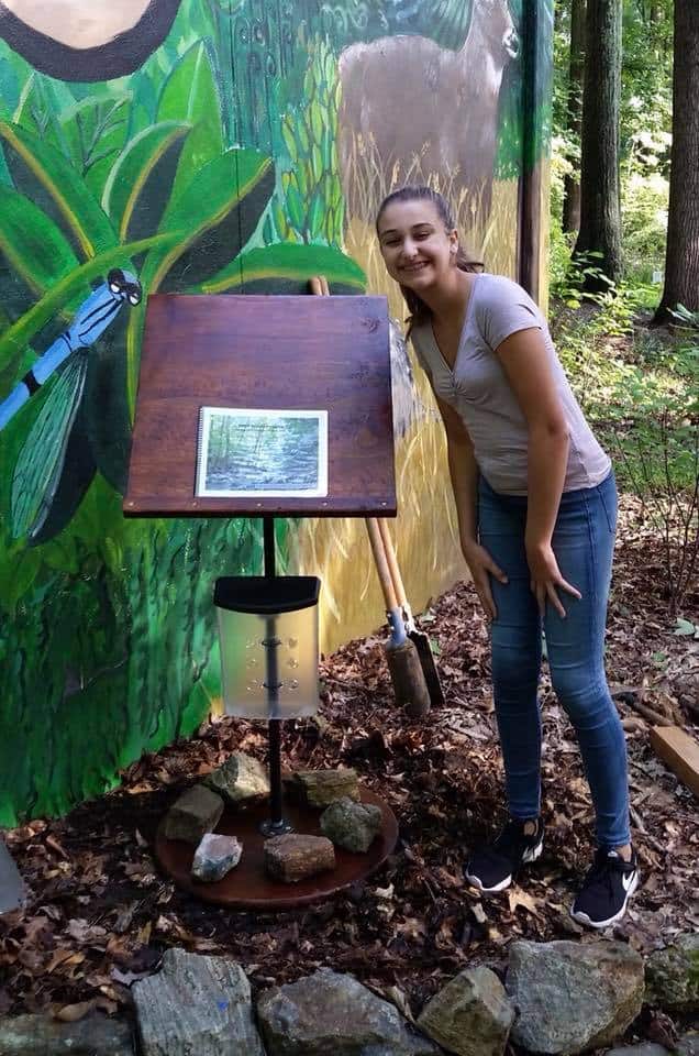 Girl scout displaying her book