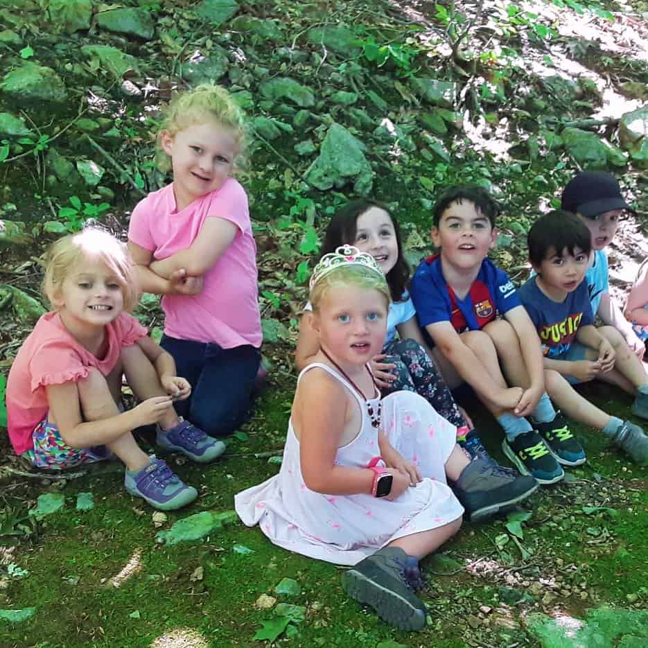 Kids on grass at Summer Nature Program